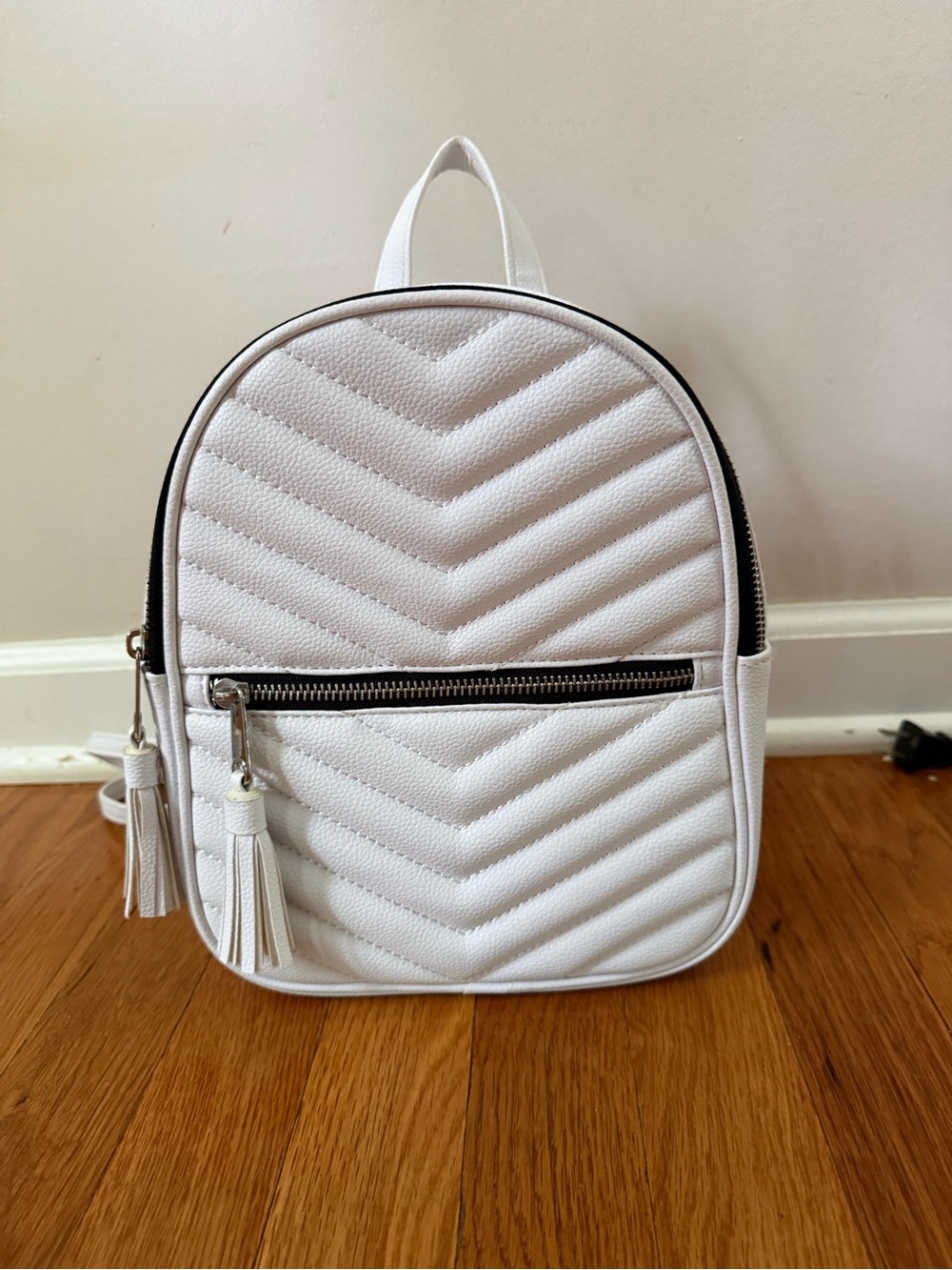 White Quilted Mini Backpack with Tassel Zipper by Claire’s